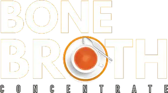 Bone broth concentrate cup with spoon and saucer, brown liquid inside.